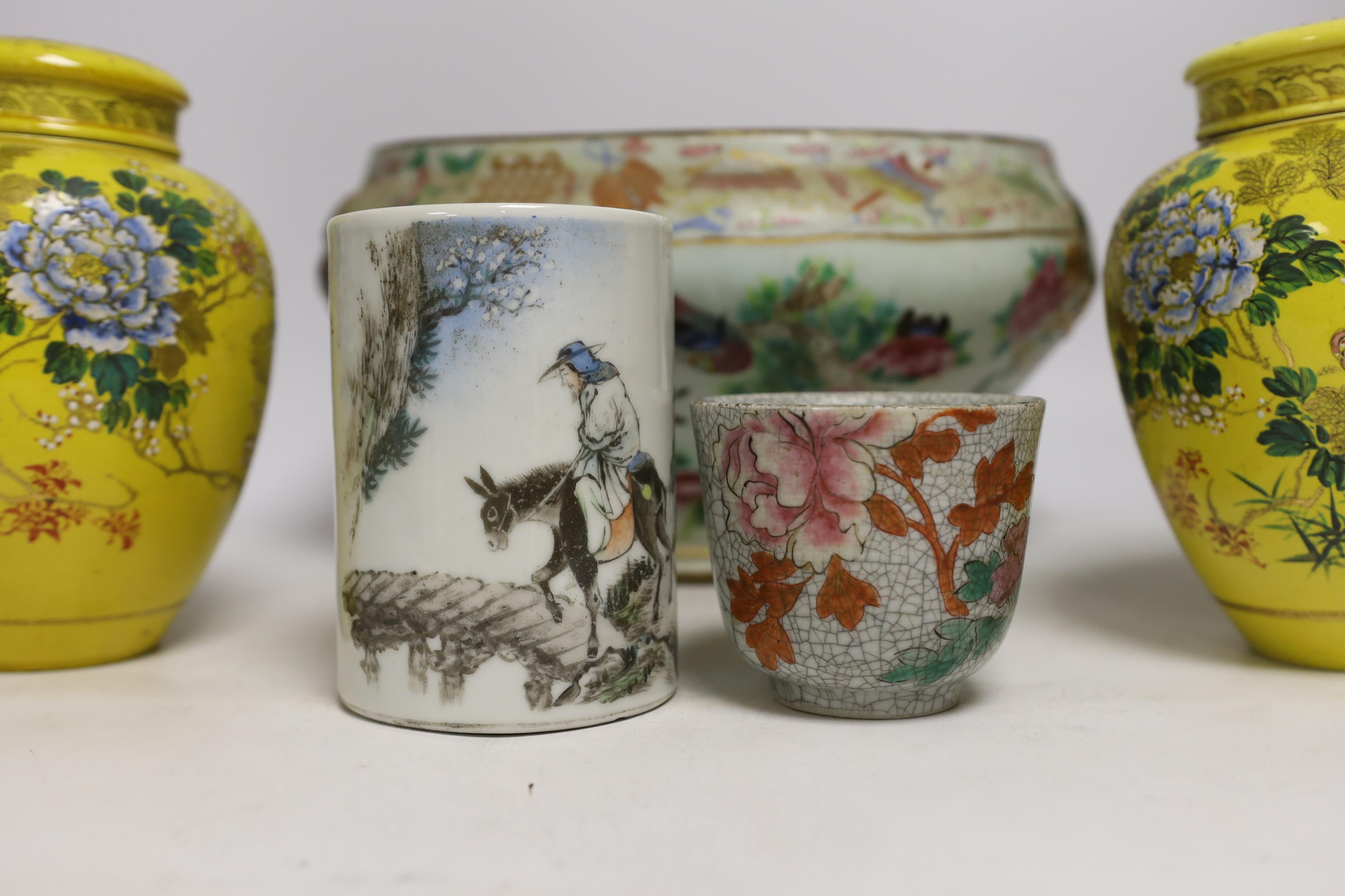 A 19th century Chinese famille rose tureen (lacking cover), a bronze mirror, a brush pot, a crackle glazed teabowl and a pair of Japanese yellow glazed satsuma jars and covers, tallest 18cm (6)